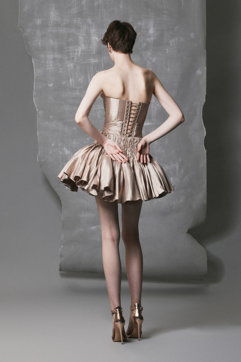 Champagne beige short flared mini dress by Phan Huy, featuring a stylish and elegant silhouette perfect for special occasions.