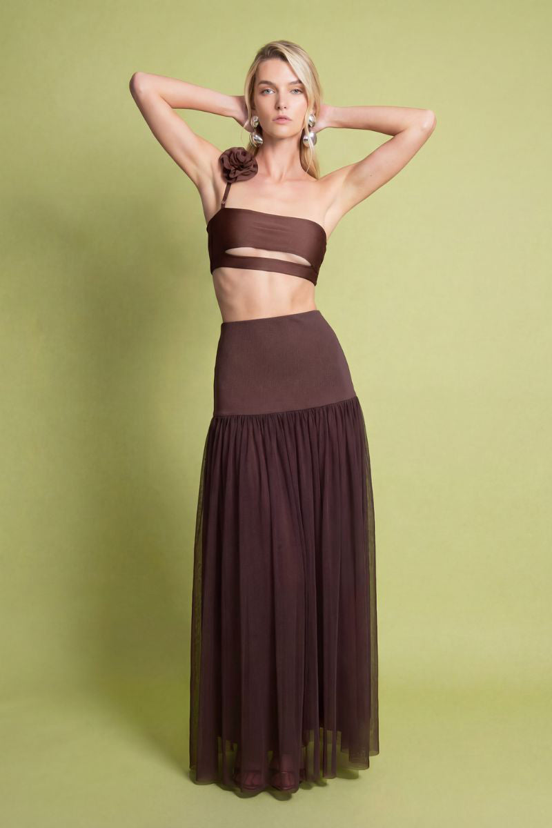 Laura Escobar Delfina brown maxi skirt with flowy fabric and elegant design, shown in a full-length view.
