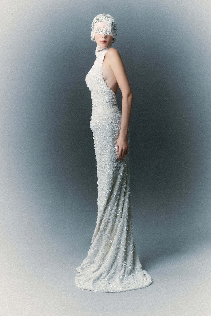 White Plan Atalia gown featuring elegant fabric and detailed design, perfect for formal occasions.