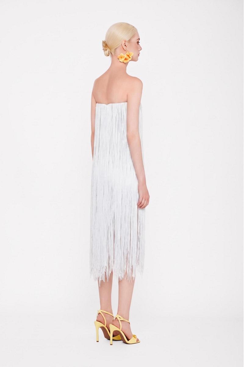 Valenciani white all-over fringe midi dress featuring flowing fabric and fringe details, perfect for elegant summer occasions.