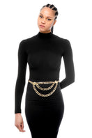 Silvia Gnecchi Donatella double chain belt with gold-tone links, styled on a model for a chic fashion accessory look.
