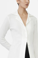 Dāl the Label modal rib knit collared cardigan displayed on a hanger, featuring a button-up front and ribbed texture.