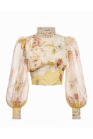 BY HAÓ VIRELLA TOP displayed on a hanger, featuring a lightweight fabric and stylish design, perfect for casual or dressy occasions.