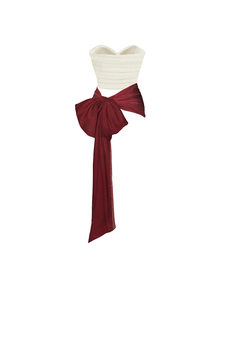Three-tone burgundy bustier top by Stolen Stores, with structured design and vibrant color blocking, shown on a model.