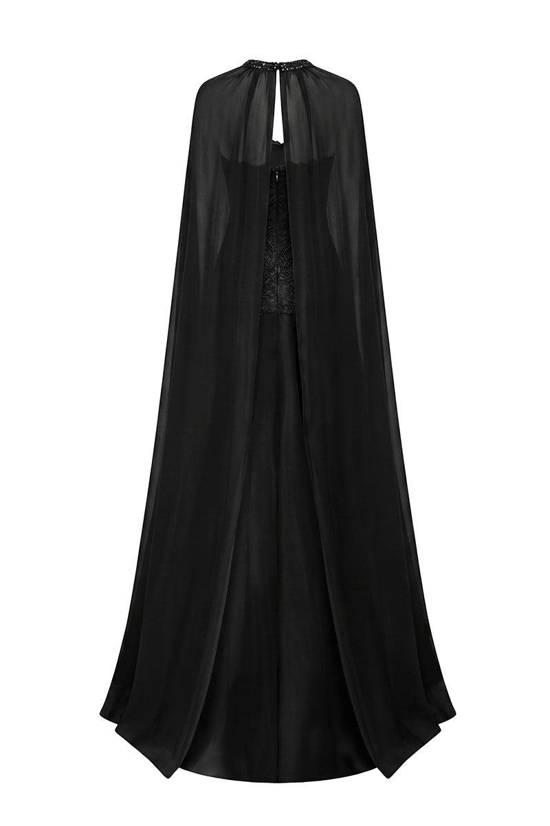 Black taffeta maxi dress with cape from Tracy Studio, featuring a flowing silhouette and elegant design.