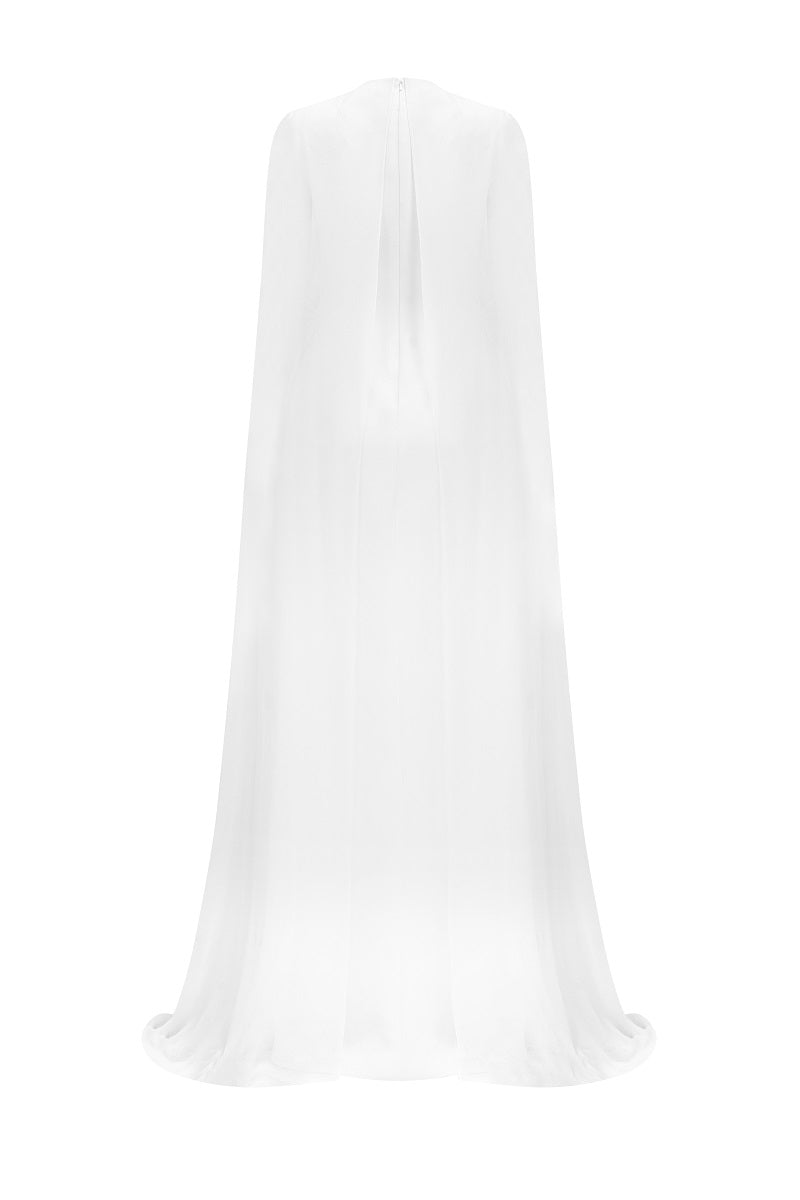 White chiffon floral maxi dress with long sleeve cape by Tracy Studio, featuring a flowing silhouette and elegant floral pattern.
