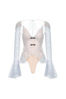 Blue floral cami top by Montsand featuring lightweight fabric and delicate floral pattern, shown on a neutral background.