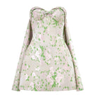 Montsand pastel corsetry mini dress with detachable cape, featuring a fitted bodice and stylish design, perfect for elegant occasions.