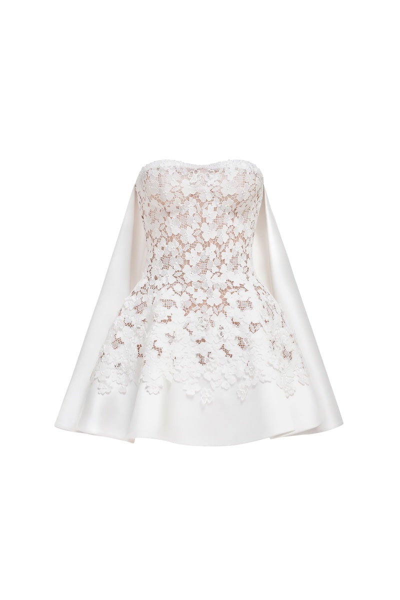 White detachable cape skater mini dress by Montsand, featuring a stylish fit, flowing cape, and trendy design for casual or party wear.