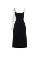 Black Montsand midi dress with a low back and stylish scarf detail, perfect for elegant occasions.