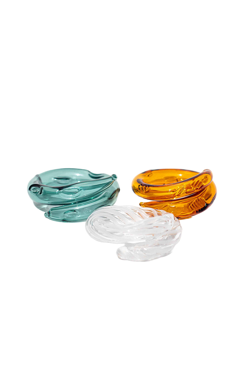 Set of three SALVÁREA rings featuring turquoise, amber, and white designs, showcasing intricate, colorful jewelry craftsmanship.