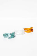 Set of three SALVÁREA rings featuring turquoise, amber, and white colors, showcasing intricate band designs on each ring.
