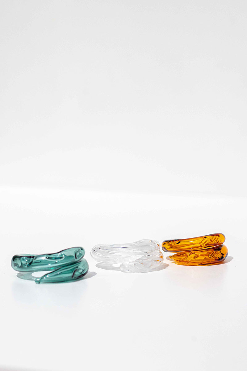 Set of three SALVÁREA rings featuring turquoise, amber, and white colors with intricate designs, perfect for boho style jewelry.