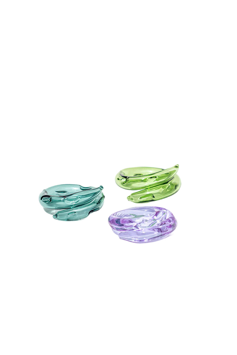 Set of three SALVÁREA rings featuring turquoise, green, and lilac colors, showcasing colorful, decorative ring designs.