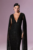 Nur Karaata GIOVANNA gown with elegant fabric, detailed embroidery, and flowing design, perfect for formal occasions.