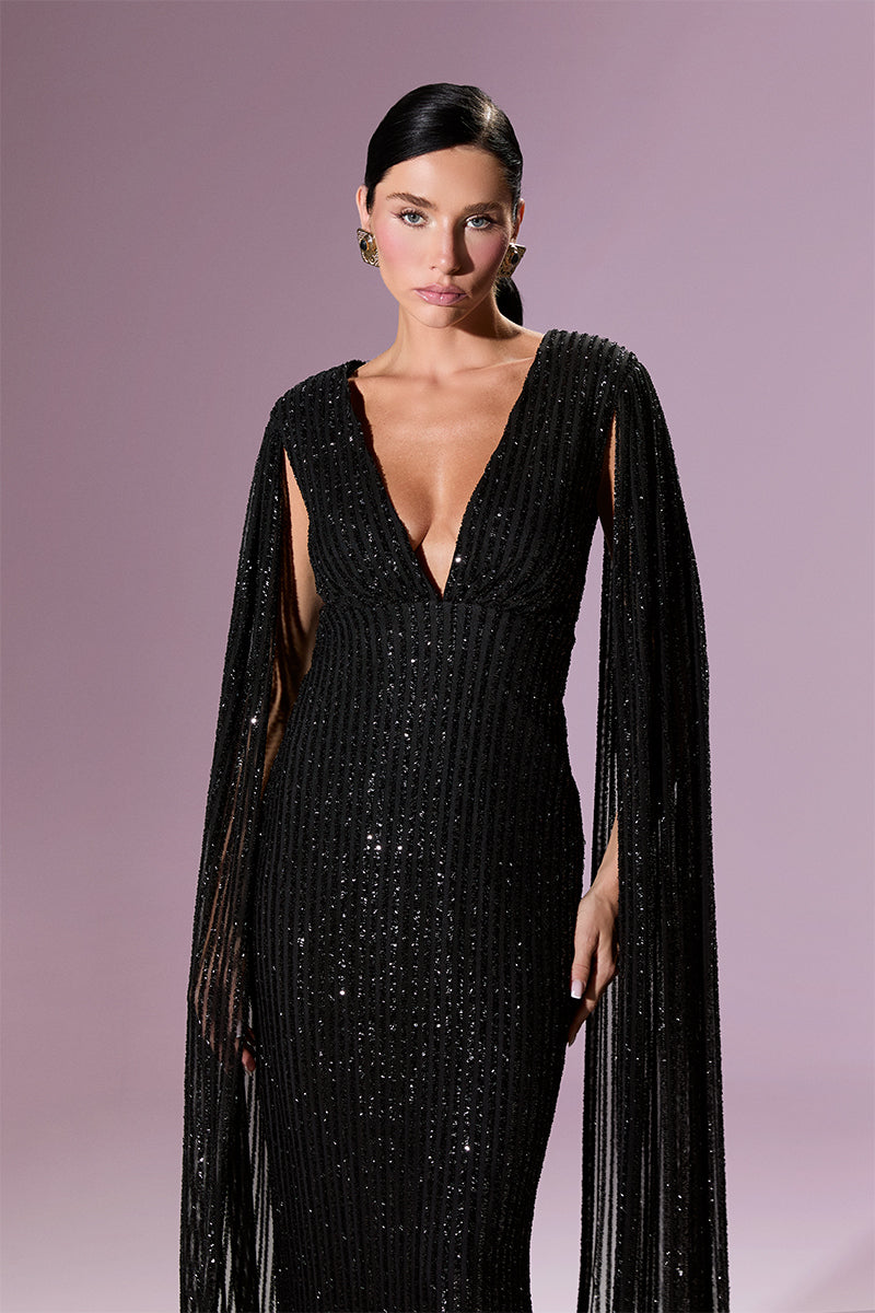 Nur Karaata GIOVANNA gown with elegant fabric, detailed embroidery, and flowing design, perfect for formal occasions.