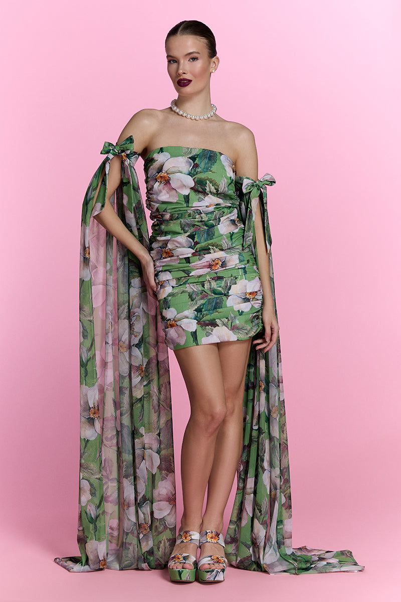 Nur Karaata Poppy Reverie Mini Dress displayed on a hanger, showcasing its stylish design and elegant fabric details.