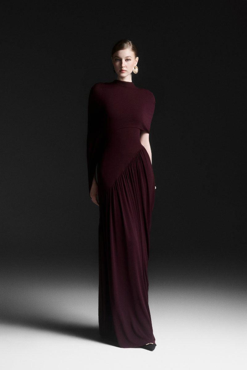 Maison Des Copains purple ruched floor-length gown with elegant draping and fitted waist for formal occasions.