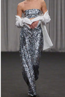 Lili Blanc sequin high-waist trousers featuring a fitted silhouette and shimmering sequin fabric for a stylish look.