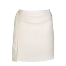 Aidan & Ice Amira mini skirt in cream, showcasing a fitted high-waist design with smooth fabric and clean hem.
