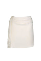 Aidan & Ice Amira mini skirt in cream, showcasing a fitted high-waist design with smooth fabric and clean hem.