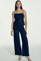 Nazlı Ceren Marona linen top in dark navy, sleeveless blouse with a relaxed fit and lightweight linen fabric, styled casually.