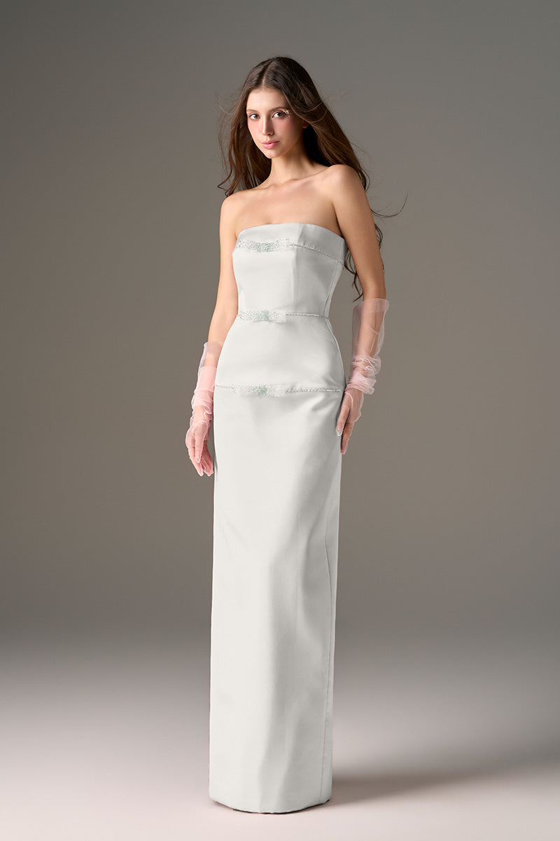 Light gray CULT MIA X I.H.F Studio taffeta maxi dress with a sleek column silhouette, flowing fabric, and elegant design.