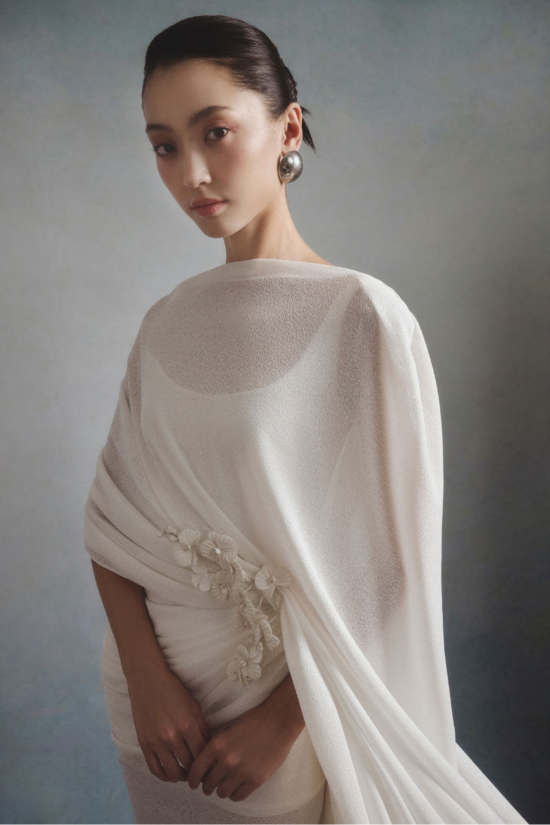 White Plan Ethereal Drape Gown showcasing flowing fabric and elegant design, perfect for formal or special occasions.