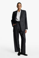 Gray striped Jasmin blazer by Acaria Studio, tailored fit with lapel collar and button closure, displayed on a hanger.