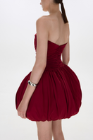 BalYKINA Clara Burgundy mini dress, fitted with long sleeves and a stylish V-neck, shown on a model.