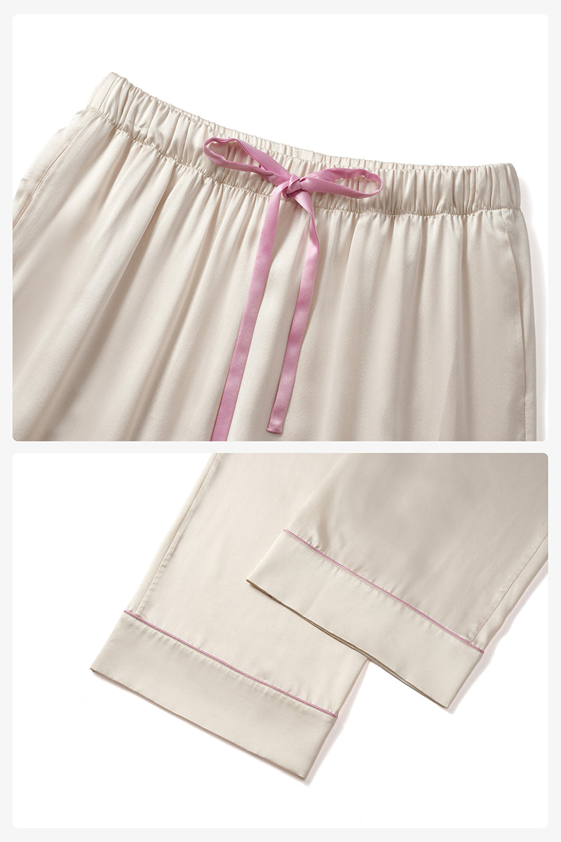 Soft blush pink silk pajama set by Not Just Pajama featuring long sleeves and relaxed fit from the Museum of Crush collection.