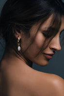 Hammered gold Baroque pearl earrings by Freya Rose featuring textured gold and unique irregular-shaped pearls.
