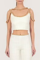 Gold thread-embroidered tweed top by Monika Dimova, showcasing intricate embroidery and textured fabric detail.