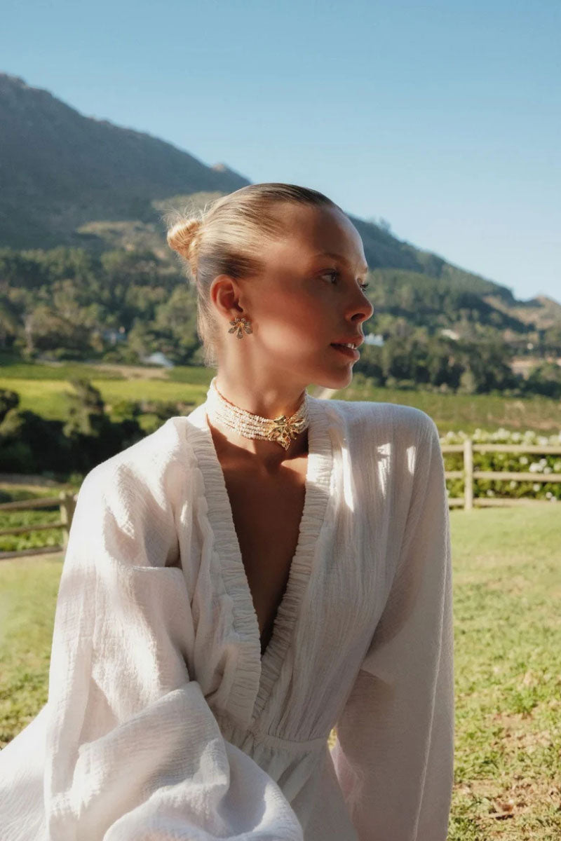 Peracas Paola ivory choker necklace with a sleek, minimalist design, featuring smooth, rounded beads on a delicate string.