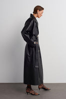 Black leather trench jacket from Acaria Studio's Journey collection, stylish and durable outerwear for women.