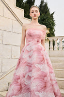 Pink tulle gown by Tracy Studio featuring a flowing, elegant design with intricate detailing and a soft, feminine silhouette.