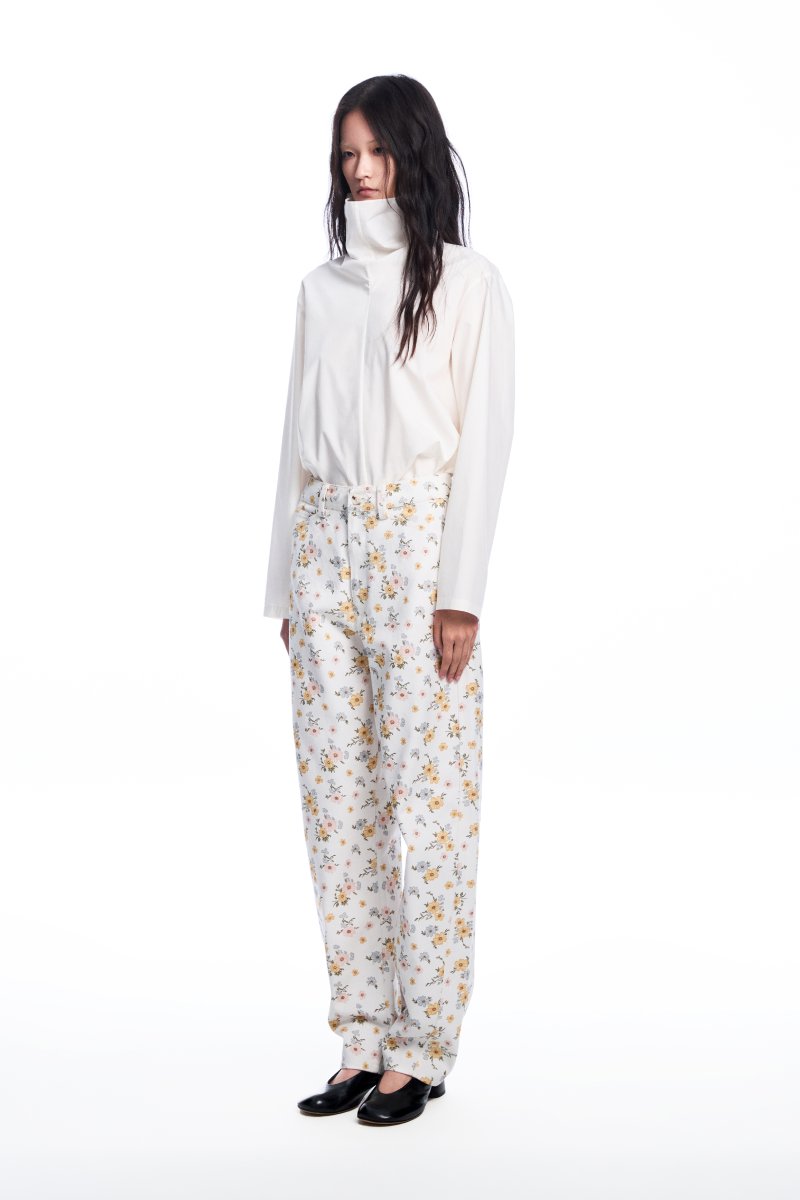 Chictopia floral jeans showing vibrant floral pattern, slim fit design, and denim material on a model.