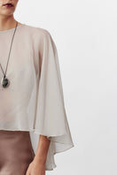 Nazlı Ceren smoked gray chiffon cape jacket with flowing fabric and elegant drape, perfect for stylish layered outfits.