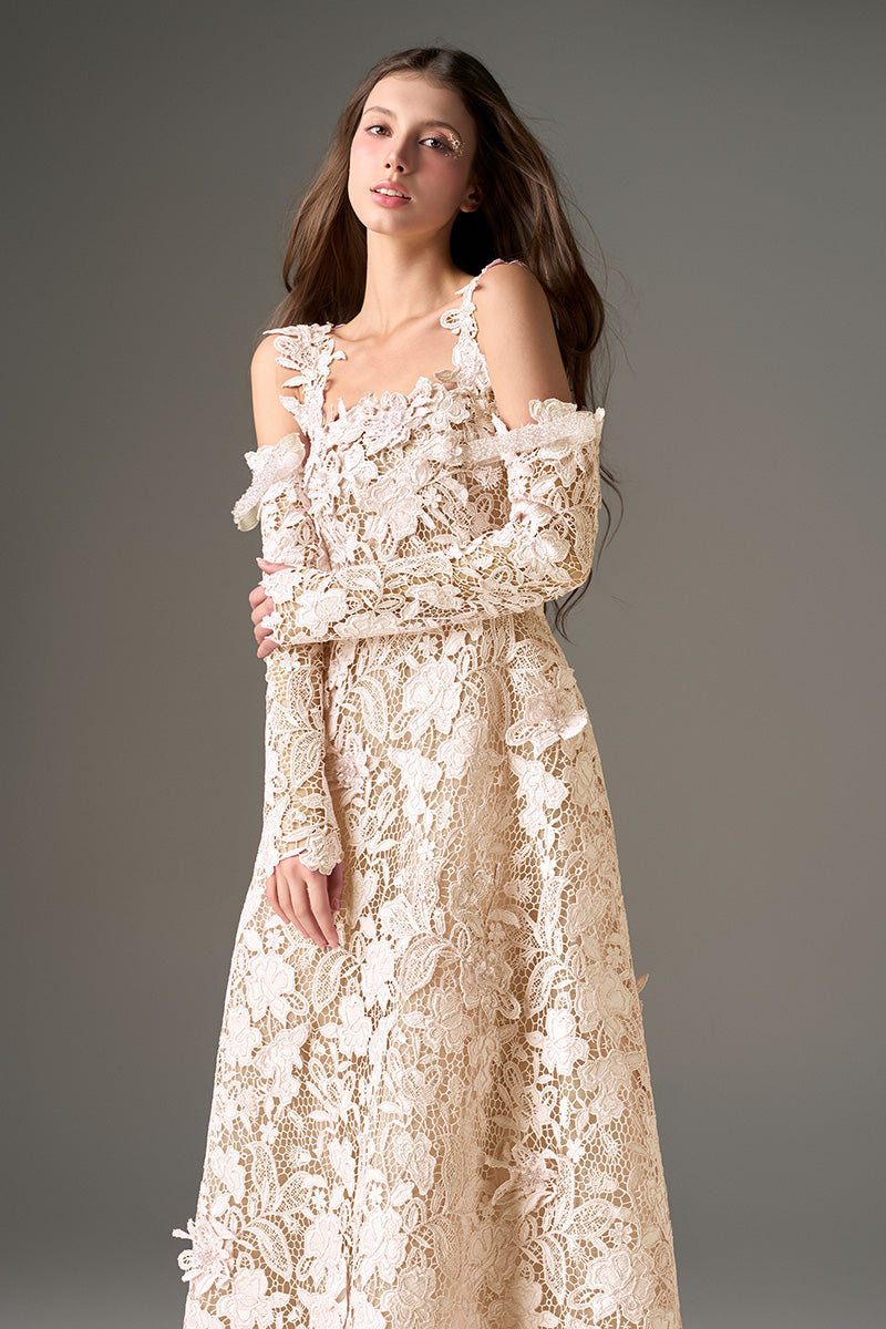 I.H.F Studio CULT MIA X floral garden ivory lace A-line maxi dress displayed on a hanger, showcasing intricate lace details and flowing fabric.