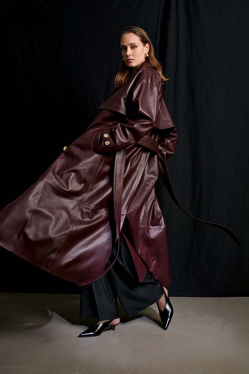 Acaria Studio Journey Leather Trench Coat in Cherry, featuring a stylish leather design with a classic trench silhouette.