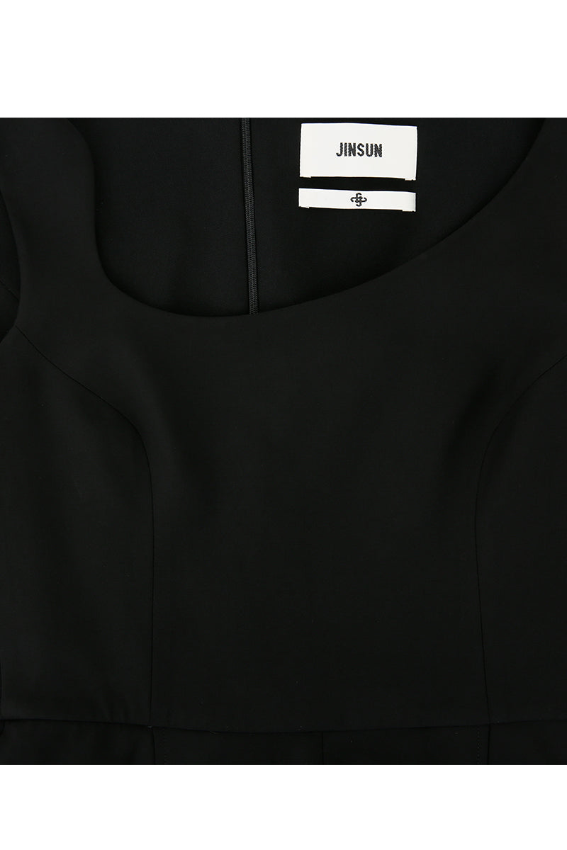 Black asymmetric-beck sleeveless jumpsuit by JINSUN, featuring a stylish design with unique shoulder details and a fitted silhouette.