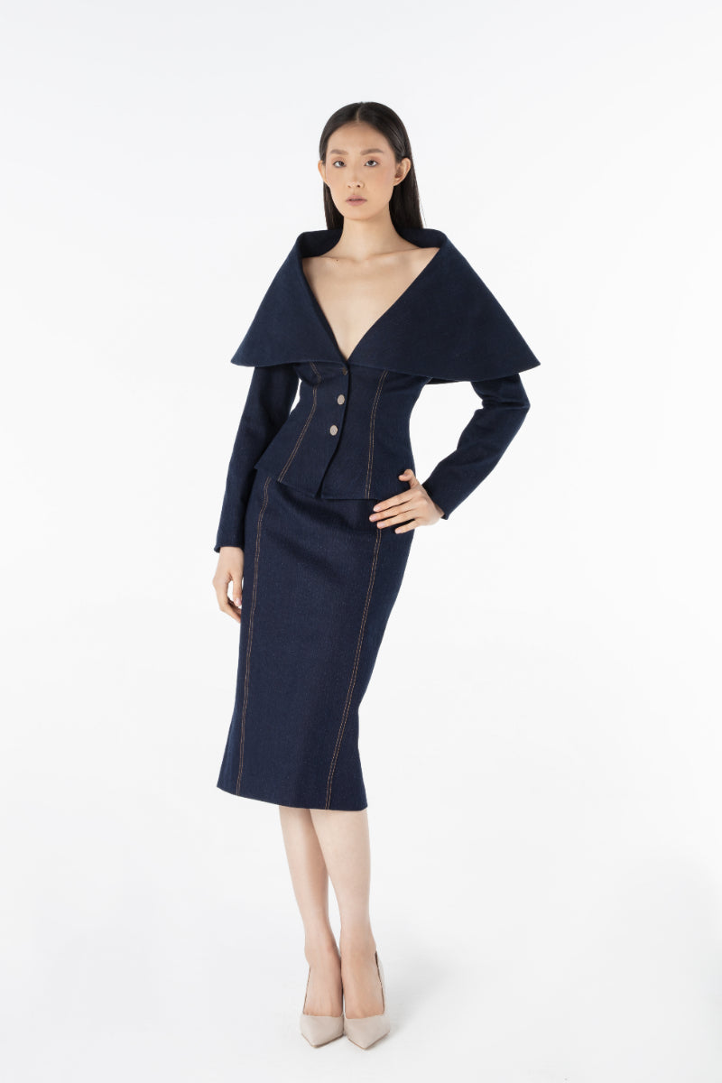 Lili Blanc LINEA denim midi skirt with classic blue wash and front slit, stylish and versatile for casual or chic outfits.