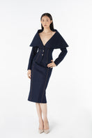 Lili Blanc LINEA denim midi skirt with classic blue wash and front slit, stylish and versatile for casual or chic outfits.
