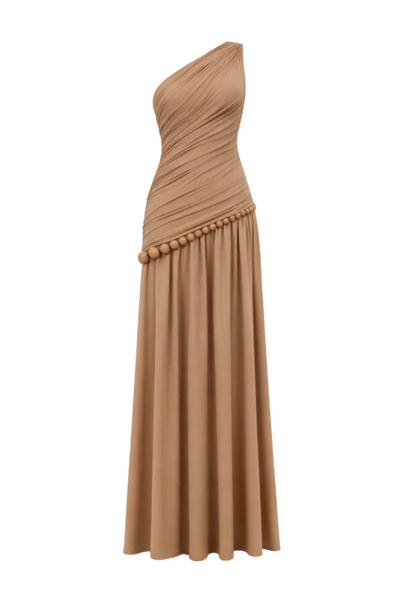 Khanum's tan Kasba maxi dress featuring a flowing silhouette and elegant design, perfect for casual or formal occasions.