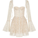 Beige Jaliyah mini dress by Montsand, featuring a stylish jali pattern, fitted silhouette, and short sleeves.