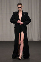 Lili Blanc oversized tailored coat with wide lapels and structured fit, shown in a neutral color on a model.
