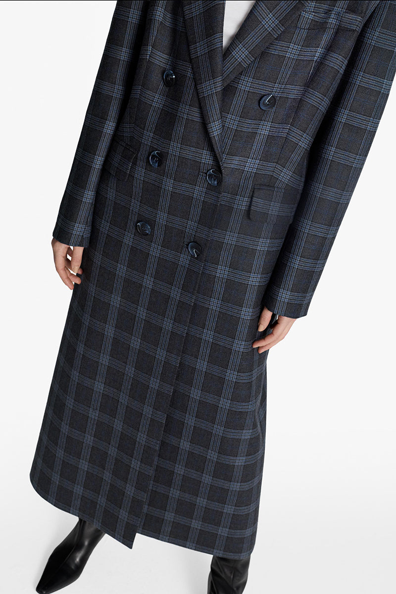 Acaria Studio Charlotte Coat in neutral fabric, featuring a tailored fit and stylish collar, displayed on a hanger.