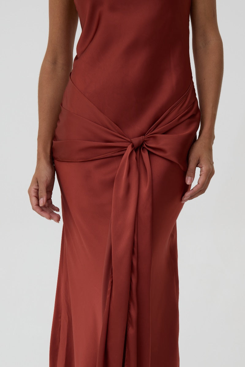 Dark red Kontenta LILIAN slip dress, a maxi dress with a flowing silhouette and elegant design, shown on a model.