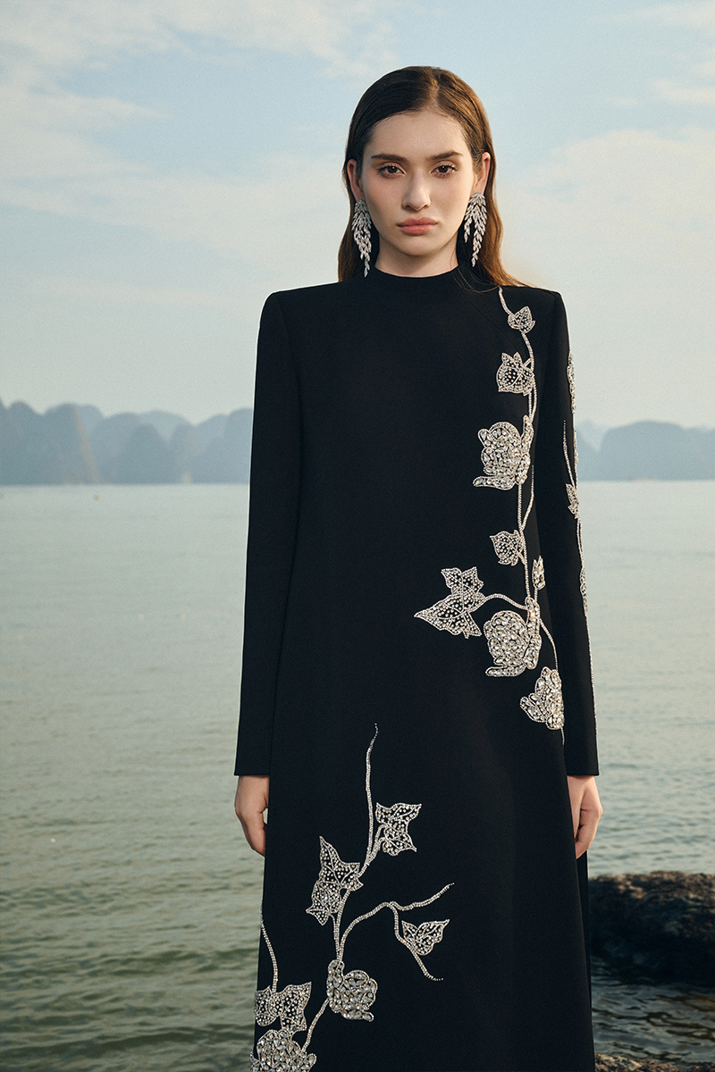Lune De Soie velvet satin gown with long back flap, featuring elegant draped fabric and sophisticated design.