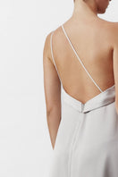 Nazlı Ceren Aimee long satin silver maxi dress displayed on a model, featuring elegant flowing fabric and a sleek design.